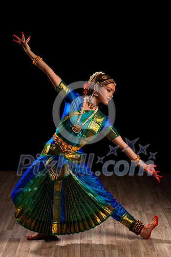 Young beautiful woman dancer exponent of Indian classical dance Bharatanatyam Young beautiful woman dancer exponent of Indian classical dance Bharatanatyam