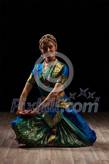 Young beautiful woman dancer exponent of Indian classical dance Bharatanatyam