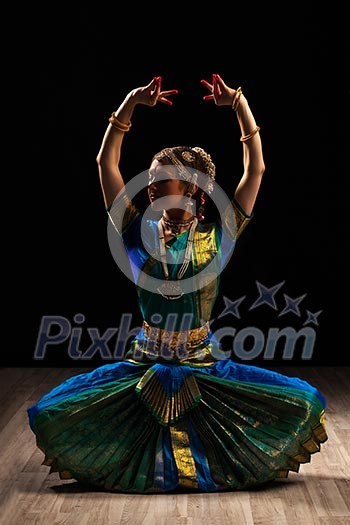 Young beautiful woman dancer exponent of Indian classical dance Bharatanatyam Young beautiful woman dancer exponent of Indian classical dance Bharatanatyam