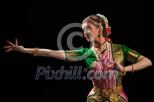 Young beautiful woman dancer exponent of Indian classical dance Bharatanatyam Young beautiful woman dancer exponent of Indian classical dance Bharatanatyam