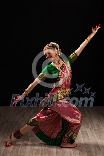 Young beautiful woman dancer exponent of Indian classical dance Bharatanatyam Young beautiful woman dancer exponent of Indian classical dance Bharatanatyam