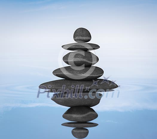 Zen stones in water with reflection balance concept