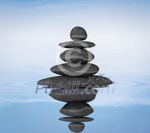 Zen stones in water with reflection balance concept Zen stones in water with reflection balance concept