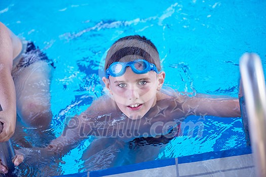 child on swimming pool learning to swim w child on swimming pool learning to swim w