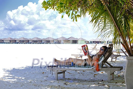 happy young woman on summer vacation on beautiful tropical beach have fun enjoy and relax