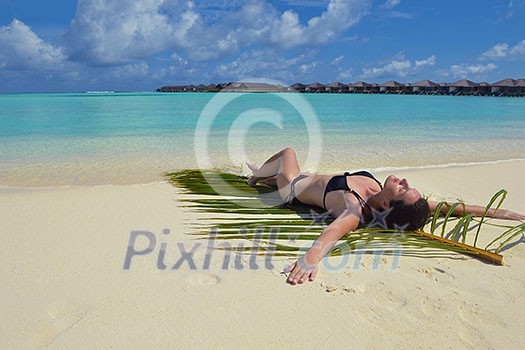 happy young woman on summer vacation on beautiful tropical beach have fun enjoy and relax