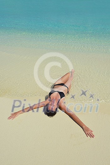 happy young woman on summer vacation on beautiful tropical beach have fun enjoy and relax