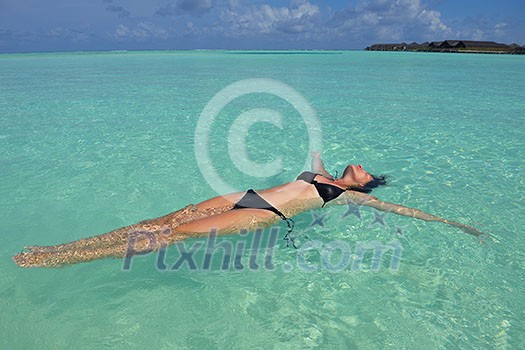 happy young woman on summer vacation on beautiful tropical beach have fun enjoy and relax happy young woman on summer vacation on beautiful tropical beach have fun enjoy and relax