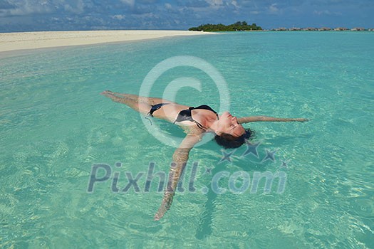 happy young woman on summer vacation on beautiful tropical beach have fun enjoy and relax