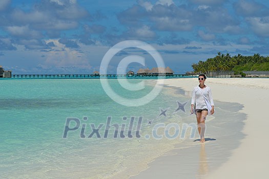 happy young woman on summer vacation on beautiful tropical beach have fun enjoy and relax