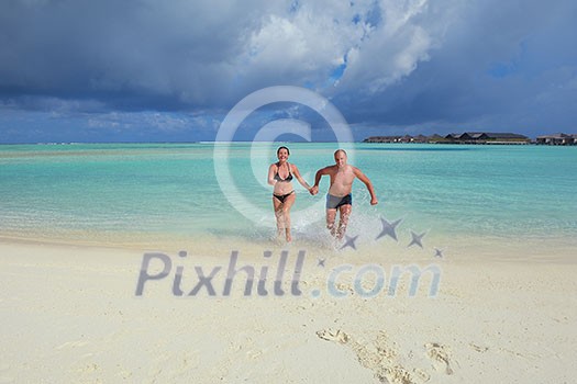 happy young couple at summer vacation have fun and relax at beautiful sunny day on beach happy young couple at summer vacation have fun and relax at beautiful sunny day on beach
