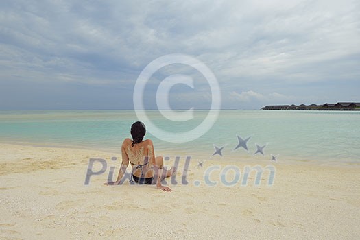 happy young woman on summer vacation on beautiful tropical beach have fun enjoy and relax