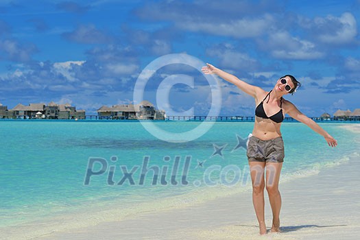 happy young woman on summer vacation on beautiful tropical beach have fun and relax happy young woman on summer vacation on beautiful tropical beach have fun and relax