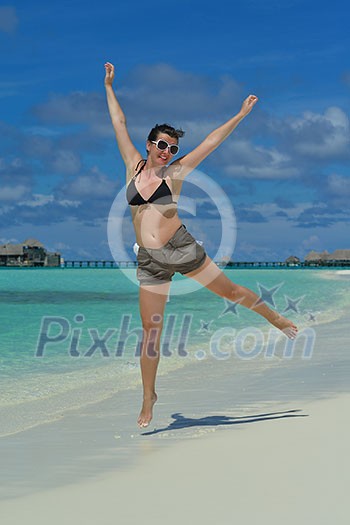 happy young woman on summer vacation on beautiful tropical beach have fun enjoy and relax happy young woman on summer vacation on beautiful tropical beach have fun enjoy and relax