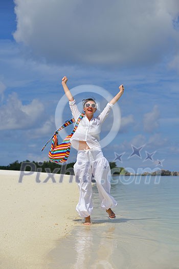 happy young woman on summer vacation on beautiful tropical beach have fun enjoy and relax happy young woman on summer vacation on beautiful tropical beach have fun enjoy and relax