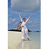 happy young woman on summer vacation on beautiful tropical beach have fun enjoy and relax