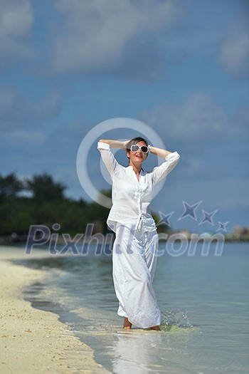 happy young woman on summer vacation on beautiful tropical beach have fun enjoy and relax happy young woman on summer vacation on beautiful tropical beach have fun enjoy and relax
