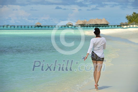 happy young woman on summer vacation on beautiful tropical beach have fun enjoy and relax