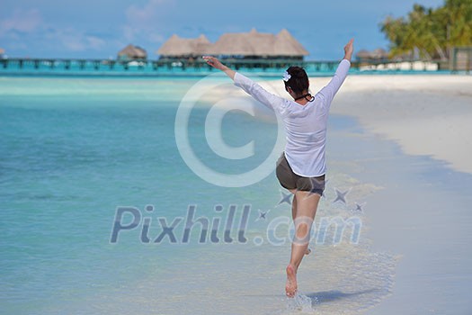 happy young woman on summer vacation on beautiful tropical beach have fun and relax happy young woman on summer vacation on beautiful tropical beach have fun and relax