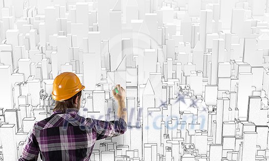 Rear view of engineer drawing project of business district Rear view of engineer drawing project of business district