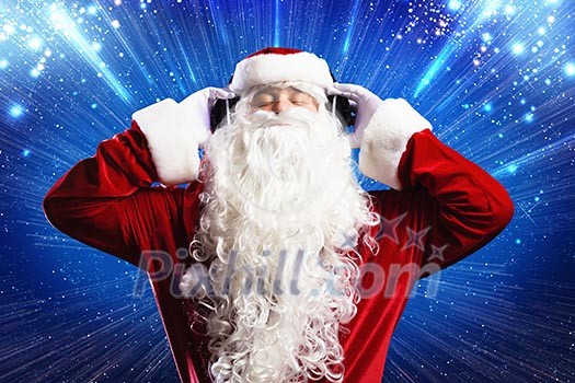 Santa Claus wearing headphones and enjoying music