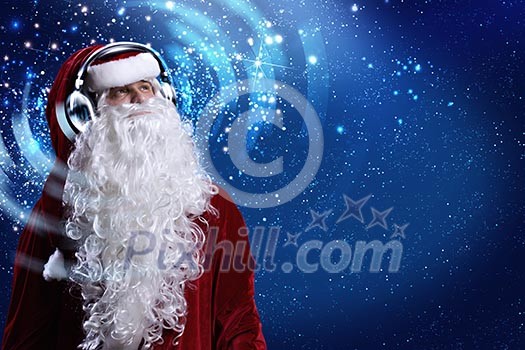 Santa Claus wearing headphones and enjoying music
