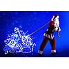 Santa Clause and Christmas gifts against blue background