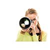 Pretty, female photographer with digital camera  - DSLR and a huge telephoto lens (color toned image; shallow DOF)