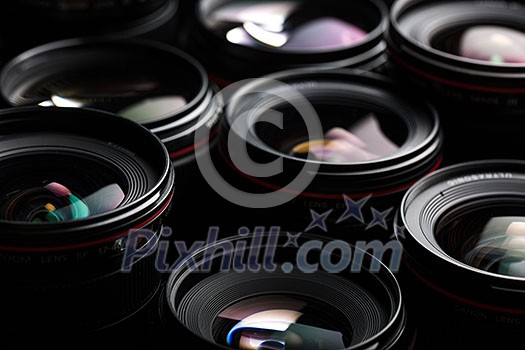 Modern camera lenses with reflections, low key image Modern camera lenses with reflections, low key image