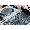 dj equipment gramophone and mixete with dj hand on party event