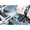 dj equipment gramophone and mixete with dj hand on party event