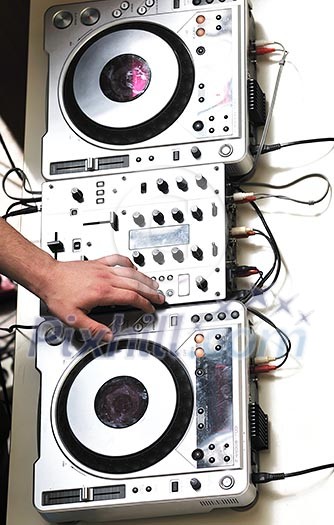 dj equipment gramophone and mixete with dj hand on party event dj equipment gramophone and mixete with dj hand on party event