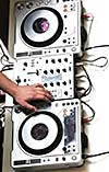 dj equipment gramophone and mixete with dj hand on party event