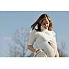 happy young pregnant womant have fun outdoor in nature at sunny day
