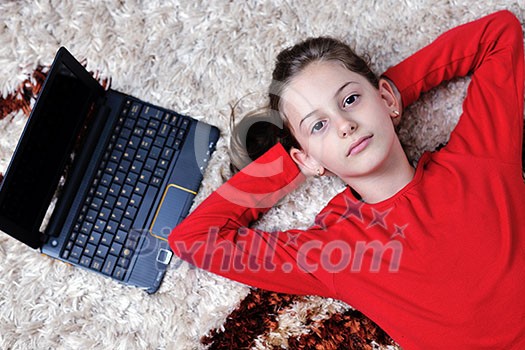 happy child school girl relax at home with laptop computer in background happy child school girl relax at home with laptop computer in background