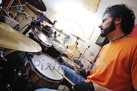 young music player and band friends have training in home garage young music player and band friends have training in home garage