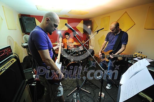young music player and band friends have training in home garage young music player and band friends have training in home garage