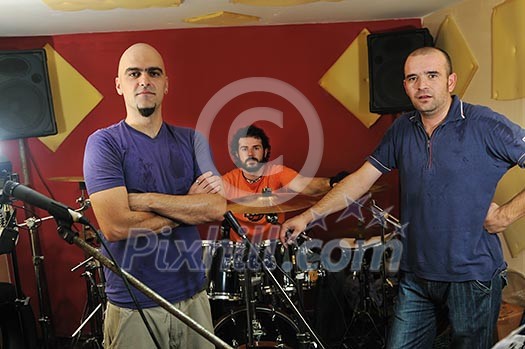 young music player and band friends have training in home garage young music player and band friends have training in home garage