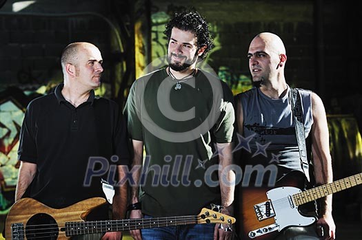 gorup of three man outdoor with music instruments representing urban and everyday city life scene gorup of three man outdoor with music instruments representing urban and everyday city life scene