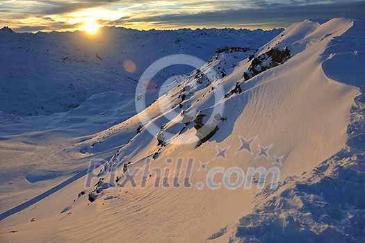 mountain snow fresh sunset at ski resort in france val thorens 