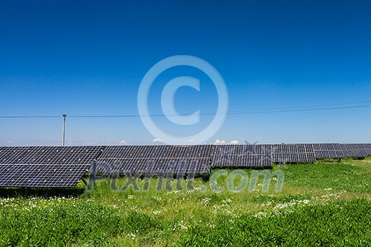 Sunlight as a resource of renewable energy: solar panels on a sunny day Sunlight as a resource of renewable energy: solar panels on a sunny day