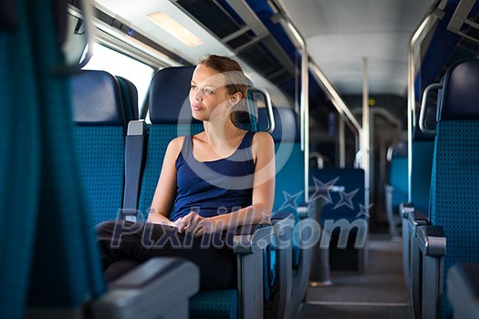 Young woman traveling by train