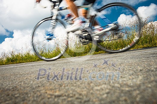 Motion blurred biker on a mountain road Motion blurred biker on a mountain road