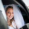 Portrait of a beautiful young bride waiting in the car on her way to the wedding ceremony