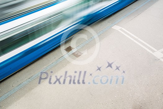 urban traffic concept - city street with a motion blurred crowd crossing a road urban traffic concept - city street with a motion blurred crowd crossing a road