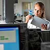 Portrait of a female researcher doing research in a lab (shallow DOF; color toned image)