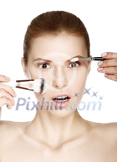 Makeup. Cosmetic. Base for perfect make-up. Beautiful woman applying make-up.