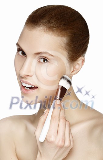 Makeup. Cosmetic. Base for perfect make-up. Beautiful woman applying make-up. Isolated on white background.