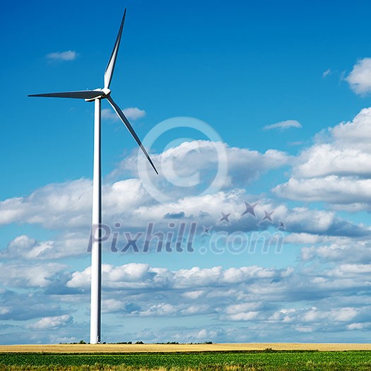 Wind generator turbine on summer landscape