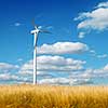 Wind generator turbine on summer landscape